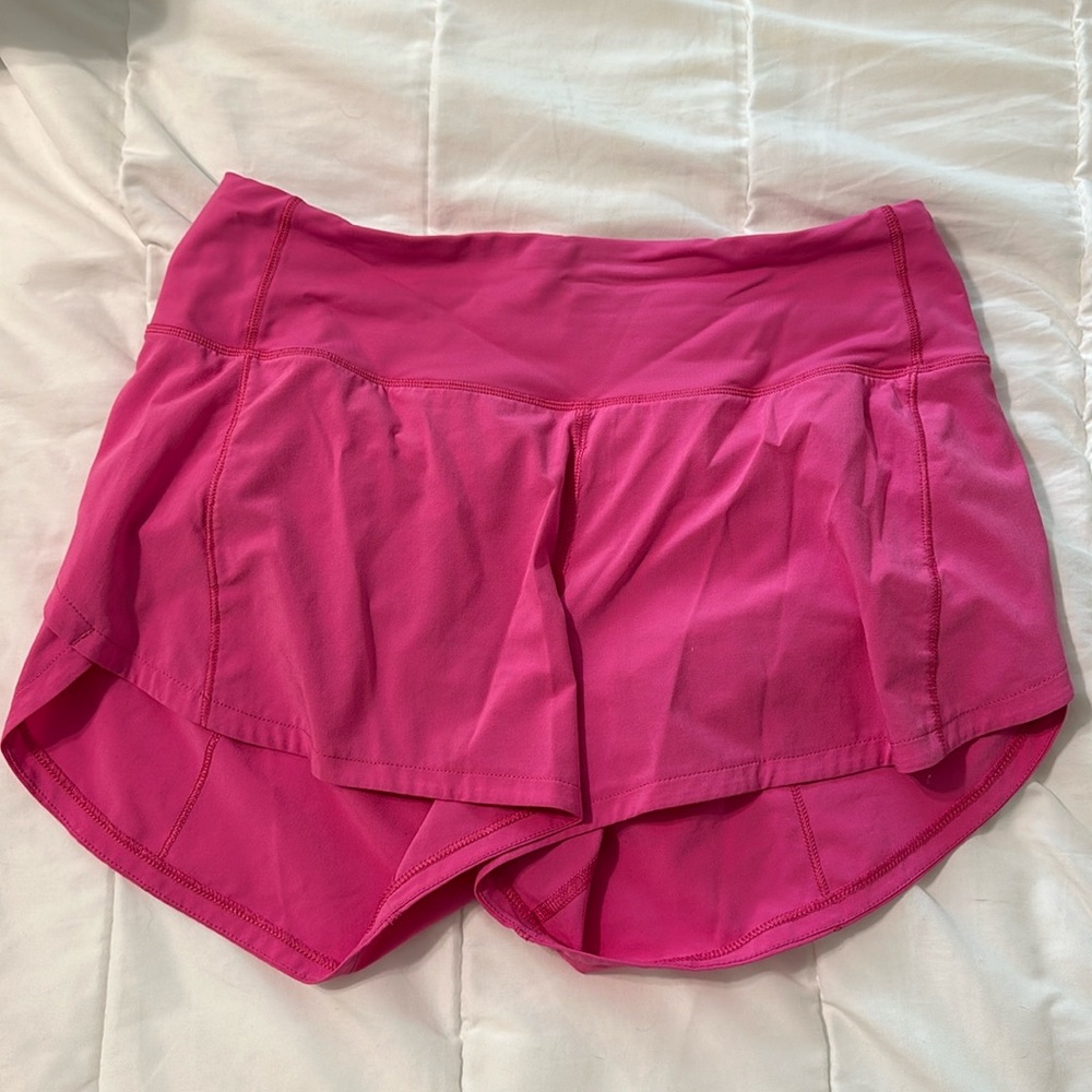 Lululemon size 4, 4 inch, bright pink, low-rise speed-up shorts